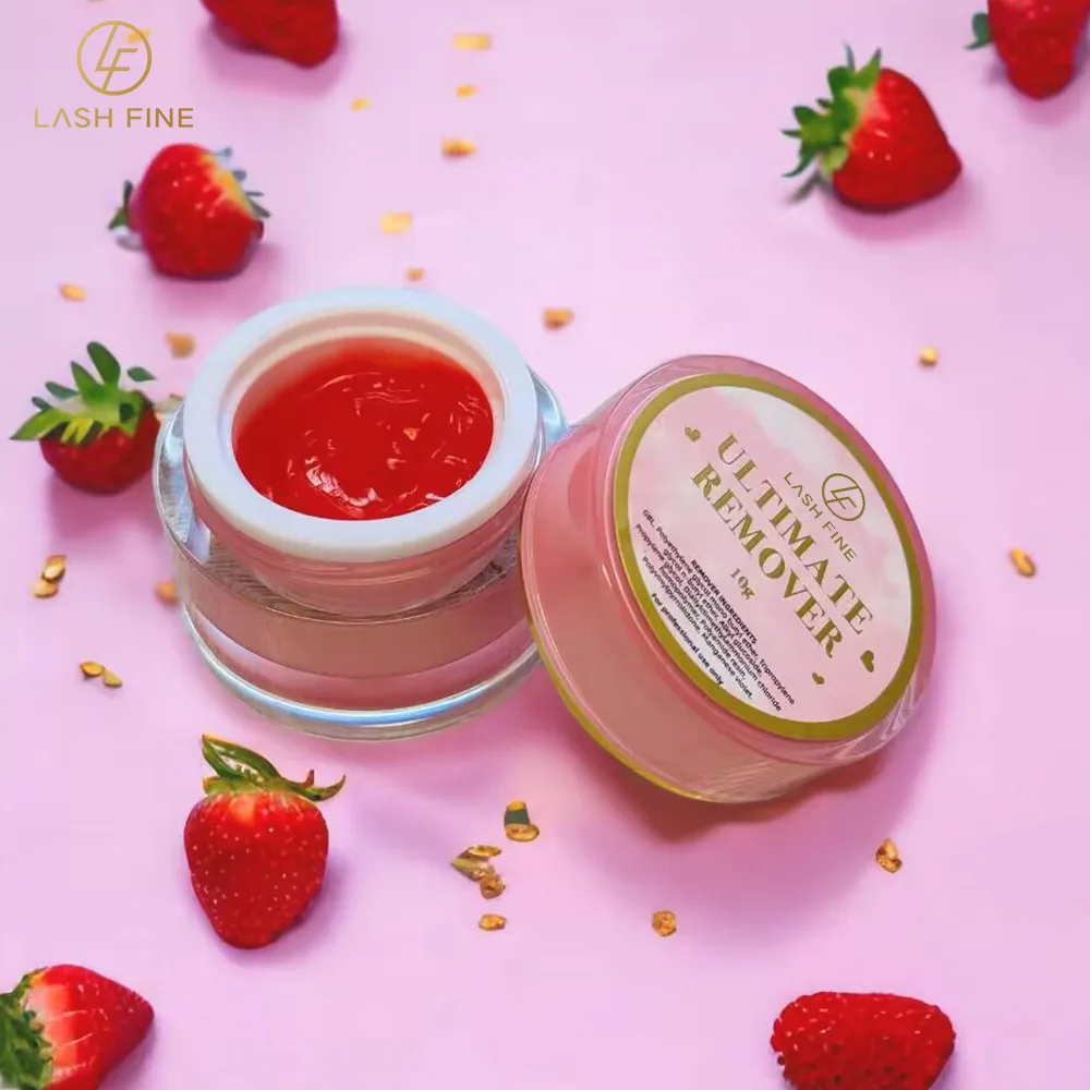 Lash Fine Ultimate Remover gel jar with lid open on a pink background with strawberries
