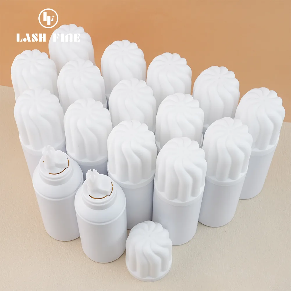 White lash foam cleanser pump bottles with flower-shaped caps