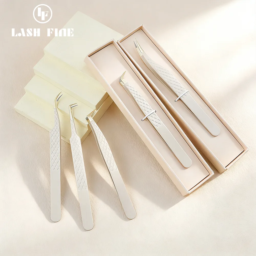 Nude-colored lash extension tweezers with their storage boxes