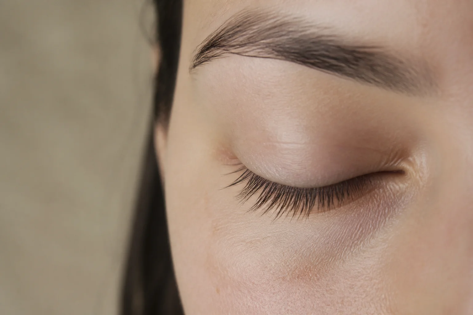 Closed eye with clean bare natural lashes after extension removal