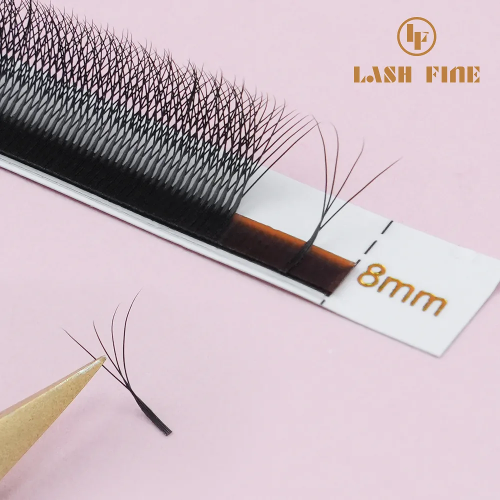 Gold tweezers picking a YY premade fan from an 8 mm lash strip