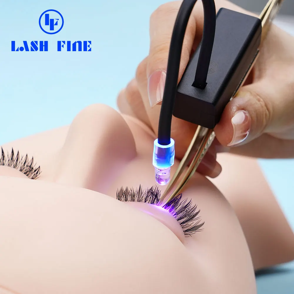 Close view of the UV LED tweezer lamp curing a single lash placement